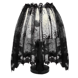Detailed view of black lace lampshade featuring spider and bat patterns for Halloween