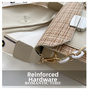 Detail view of woven straw flap with golden metal lock and daisy pattern canvas strap