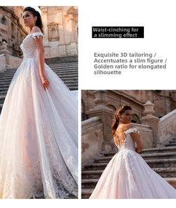 Close-up of off-the-shoulder wedding dress with intricate lace embroidery and back details
