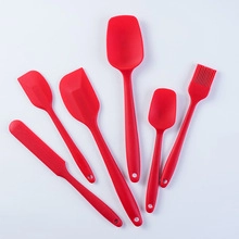 6-piece red silicone spatula and brush set for professional kitchen use on white background