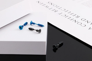 Detailed view of blue and black screw shaped stainless steel studs in punk industrial style