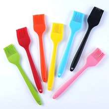 Colorful silicone basting brushes set for BBQ and baking shown on a plain white background