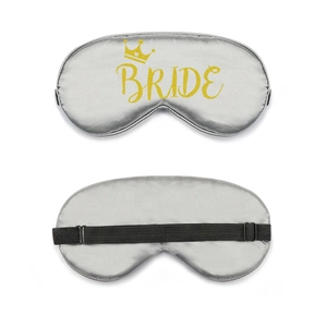 Detail view of grey satin Team Bride sleep mask showing golden crown and adjustable strap