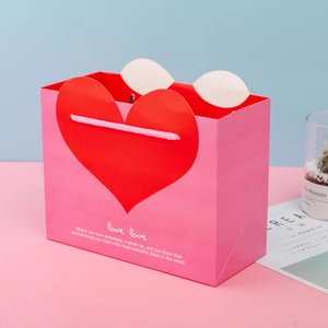 Pink rectangular gift bag with red heart pattern and love typography for Mother Day