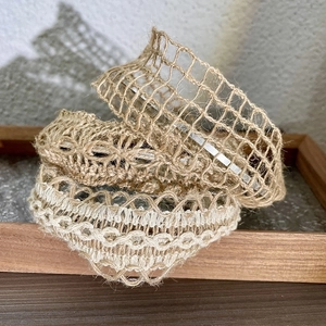 Natural jute woven headband with white lace trim and rustic hollow mesh texture
