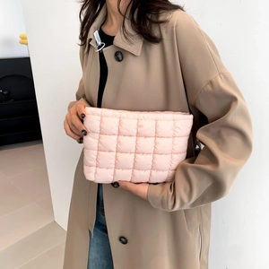 Pink quilted fabric clutch bag for women with square stitched pattern in soft pink finish