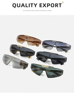 Multiple colors of futuristic shield sunglasses with metal top bar in a studio group shot