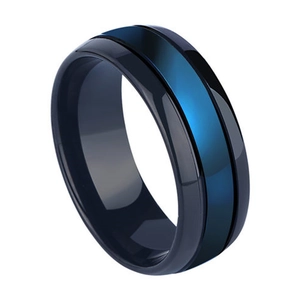 Close-up of black tungsten ring with vibrant blue center stripe and polished finish