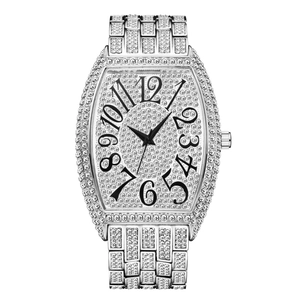 Macro shot of silver tonneau luxury watch with iced out crystal dial and diamonds