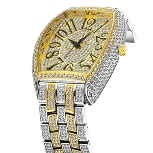 Detail of tonneau-shaped luxury gold and silver quartz watch with full diamond settings