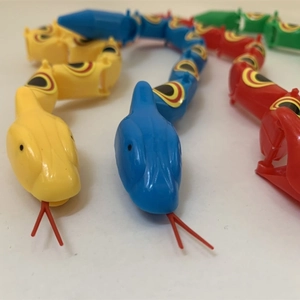 Jointed plastic toy snakes in multiple colors with movable segments and flicking tongues