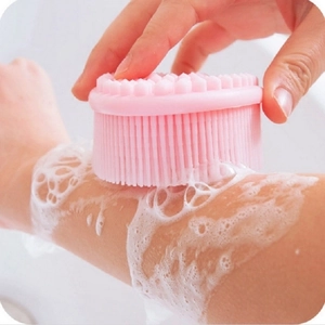 Pink silicone baby bath brush with soft bristles for gentle body cleaning and massage