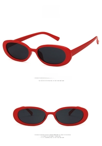 Front and side views of vintage red oval sunglasses with dark grey lenses