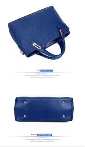 Detailed top view and bottom view of royal blue embossed handbag with gold hardware