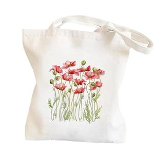 Close-up of a white canvas tote bag featuring an elegant red poppy watercolor floral print