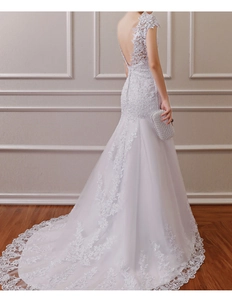 Exquisite back view of lace mermaid wedding dress with long train and open back detail