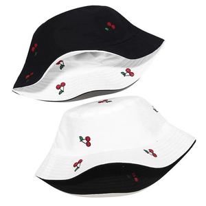 Detail showing high-quality cherry embroidery on reversible cotton bucket hat fabric