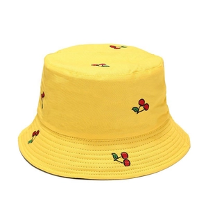 Yellow reversible bucket hat with red cherry embroidery for summer sun protection