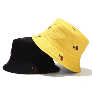 Double-sided reversible bucket hat with cherry embroidery in black and yellow cotton canvas