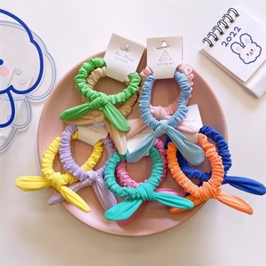 Set of colorful rabbit ear hair scrunchies in pastel macaron colors with knit texture