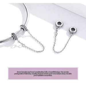 Detailed macro view of S925 sterling silver safety chain with vintage vine engravings