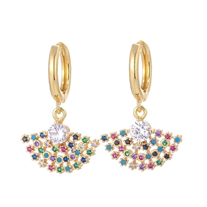 Fashionable gold fan-shaped drop earrings with colorful zircon stones on white background
