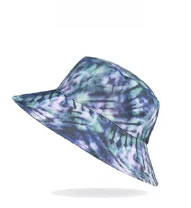 Close-up of tie-dye cotton bucket hat featuring blue and purple printed canvas textures