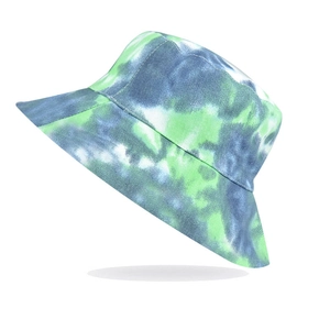 Detailed texture of cotton bucket hat featuring blue and green tie-dye print patterns