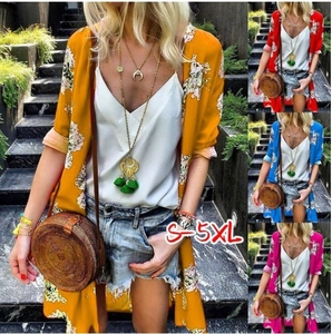 Close-up of lightweight floral chiffon cardigans in yellow, red, and blue colors