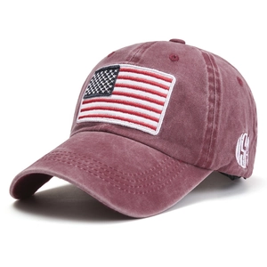 Vintage washed cotton baseball cap in burgundy with American flag embroidery and USA side text