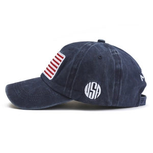 Detailed view of USA embroidery and red-white stripes on washed cotton baseball cap