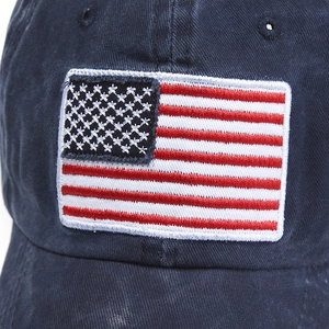 Close-up of American flag embroidery on navy blue washed cotton vintage baseball cap