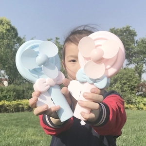 Portable cartoon lollipop hand-press fans in pink and blue for kids outdoor play