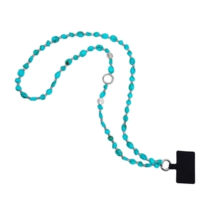 Detail view of ethnic turquoise bead phone strap with silver metal spacers and black connector