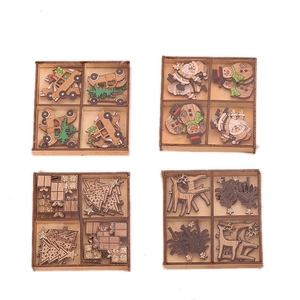 Set of DIY wooden Christmas ornaments with Santa, snowman and deer in wood gift boxes