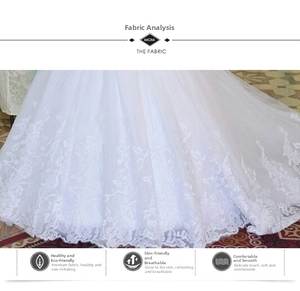 Detailed view of delicate white floral lace embroidery on breathable mesh wedding dress fabric