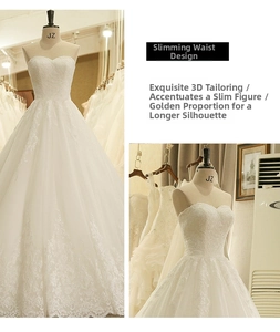 Dettaglio dell'abito da sposa bianco a cuore con ricami floreali in pizzo di alta qualità