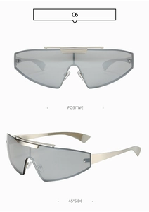 Close-up of silver punk wraparound sunglasses with rivet details and metallic arms