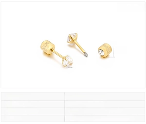 Detail showing gold stainless steel stud earrings with 4mm round cubic zirconia inlay