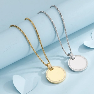 Gold and silver twist chain necklaces with sparkling round rhinestone-set pendants
