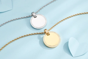 Macro detail of gold and silver circular pendants with pavé crystals on rope chains