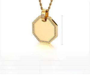 Macro view of gold stainless steel octagonal pendant with white zircon inlays and twist chain