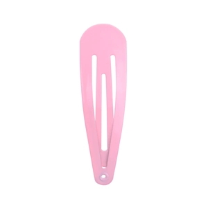 Detail view of the pink teardrop-shaped metal snap hair clip with a smooth painted finish