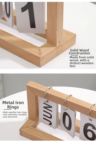 Detail of the minimalist wooden calendar showing solid wood frame and metal flip rings