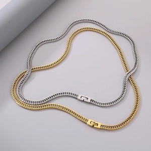 Detail of woven stainless steel Cuban dragon bone chains in gold and silver finishes