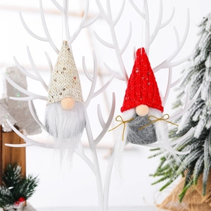 Christmas faceless gnome ornaments with sequined knit hats and long white beards on a tree