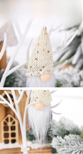 Detail of Christmas gnome with cream sequined knit hat and soft white plush beard