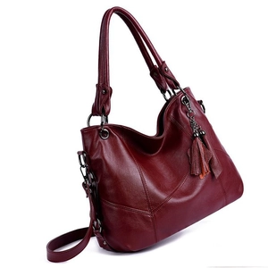 Large capacity dark red faux leather shoulder bag for women with tassel charm detail