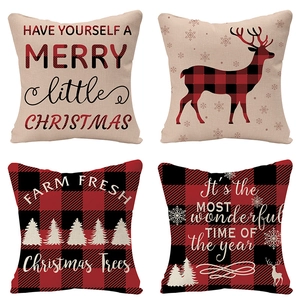 Detail of Christmas linen pillow covers featuring festive patterns and red buffalo plaid