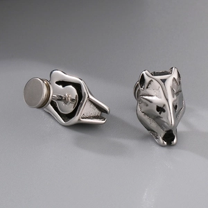 Punk style stainless steel wolf head stud earrings with a vintage silver metallic finish